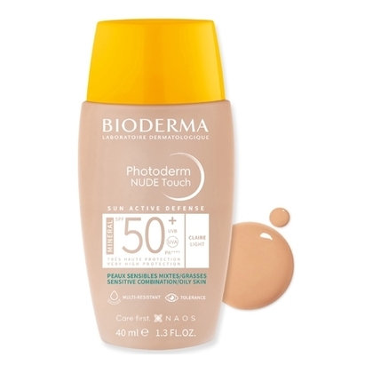 Fluide spf50+ teinté clair, effet peau nue - peaux sensibles mixtes à grasses