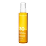 150ML Clarins SOLAIRE Huile solaire embellissante haute protection corps spf30 1 of 4 Huile solaire embellissante haute protection corps spf30