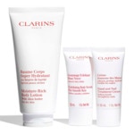 Clarins SOINS CORPS HYDRATANTS Coffret baume corps super hydratant + gommage exfoliant + crème jeunesse des mains + trousse 3 of 4 Coffret baume corps super hydratant + gommage exfoliant + crème jeunesse des mains + trousse